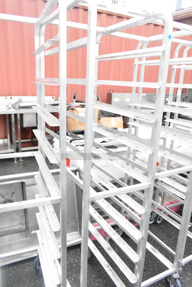 Winholt metal commercial pan transport rack on casters, multiple shelves, durable construction, ideal for kitchen use.