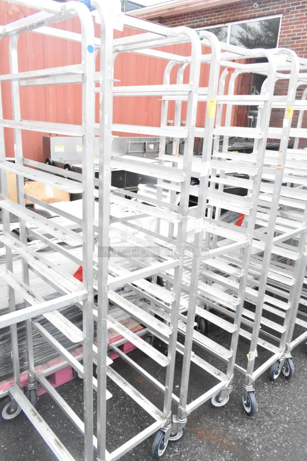 Winholt metal commercial pan transport racks with casters; sturdy, multi-shelf design, suitable for kitchen use, good condition.