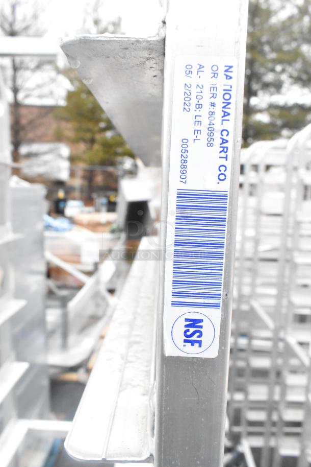 2 Winholt metal commercial pan transport racks with casters. Label shows "National Cart Co.", NSF certified.