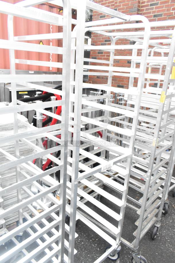 Winholt metal commercial pan transport rack with multiple shelves, commercial casters, suitable for bakery use. Good condition.