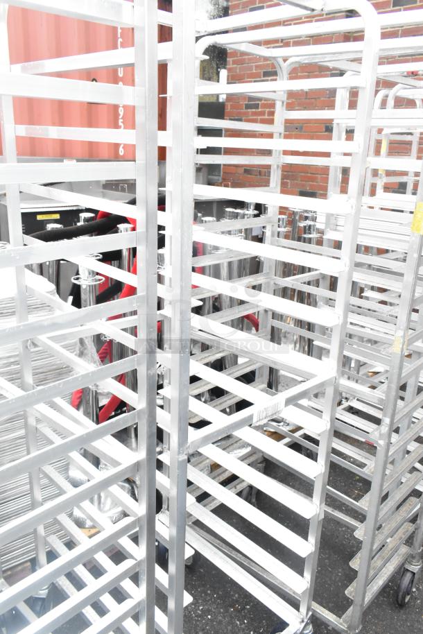 Winholt metal commercial pan transport rack, features multiple shelves, sturdy construction, on commercial casters for mobility.