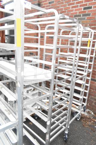 Winholt metal commercial pan transport racks on casters, sturdy frame, ideal for bakery use, good condition, bid for two.