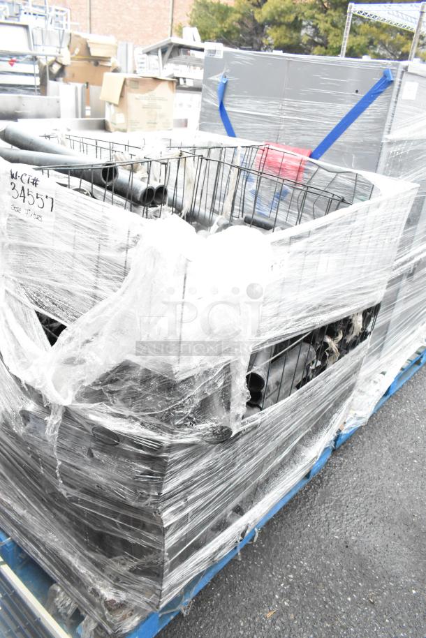 Pallet lot with various items, including black poly pipes, wrapped in plastic. Appears in used condition.