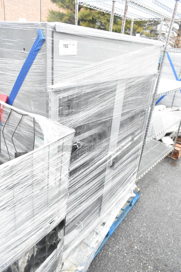 Gray 2-door merchandising cabinets, wrapped, auction lot 192, excellent condition. Double your bid offer available.