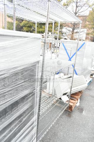 Chrome finish 5-tier wire shelving unit, good condition. Buyer must dismantle and consider freight charges.