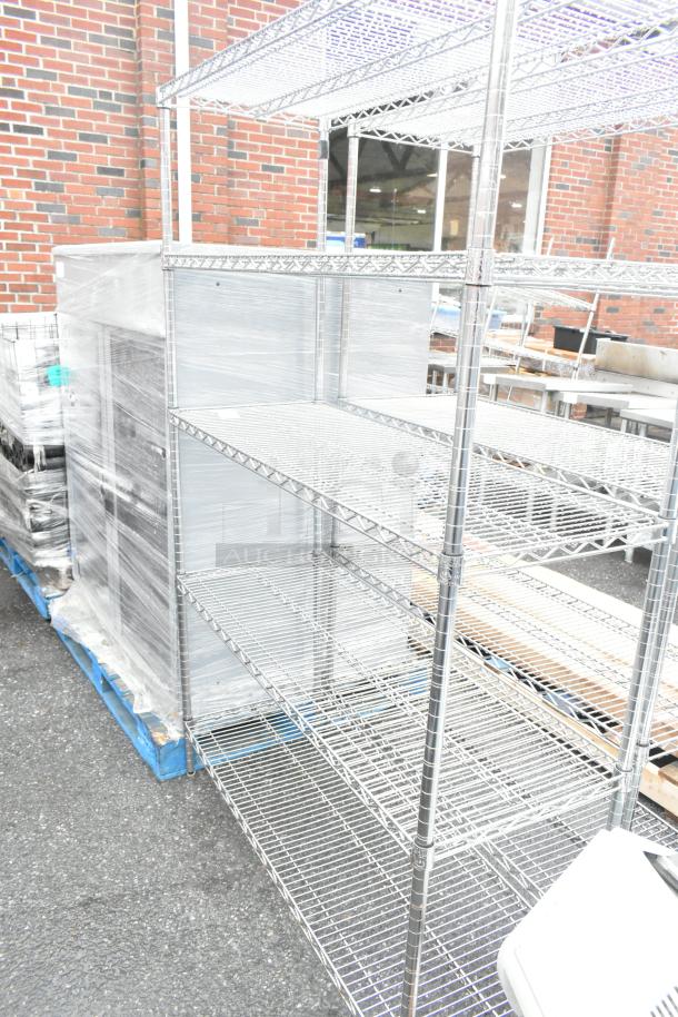 Chrome finish 5-tier wire shelving unit in good condition, sturdy design. Buyer must dismantle. Consider freight charges.