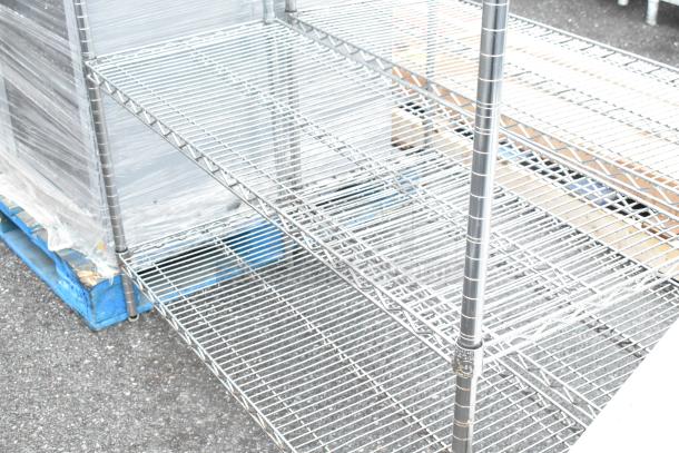 Chrome finish 5-tier wire shelving unit, sturdy design, excellent condition. Buyer must dismantle. Freight charges apply.