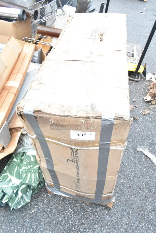 Boxed Regency 600UDT50R 50" undercounter dishtable, new scratch and dent condition. Label reads "199" with quantity.