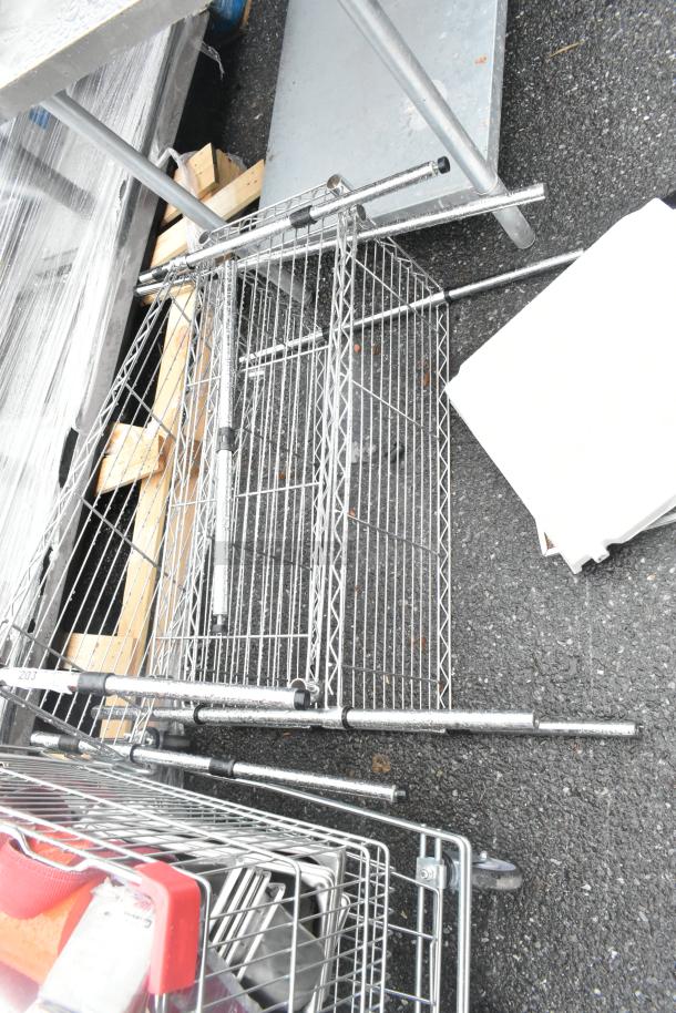 Chrome finish wire shelving units, disassembled. Includes poles and wire shelves. Good condition. Two units available.