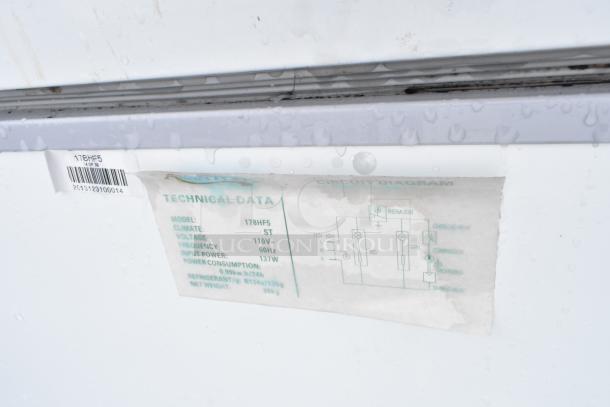 Avantco 178HF5 metal chest freezer label showing model details, voltage, frequency, power, and consumption specs.