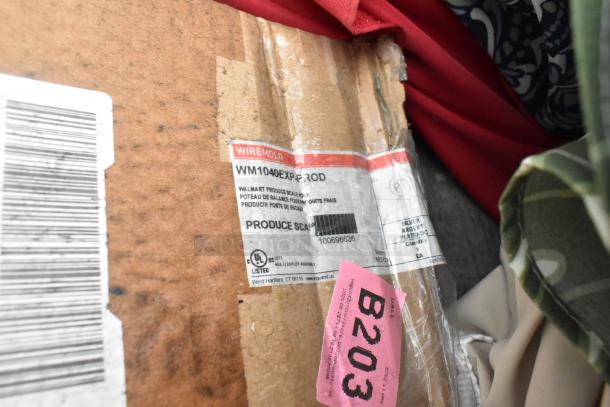 Box with Wiremold WM1040EXPPROD label for new produce scale, showing UL certification, and slight wear on packaging.