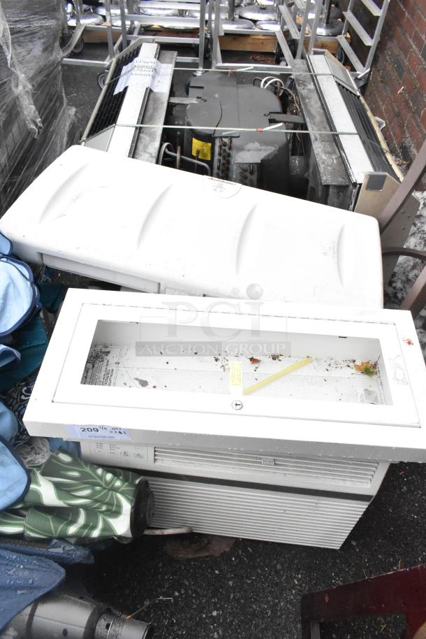 Three assorted items including a fire extinguisher cabinet and a wall-mounted poly diaper changing station; used condition.