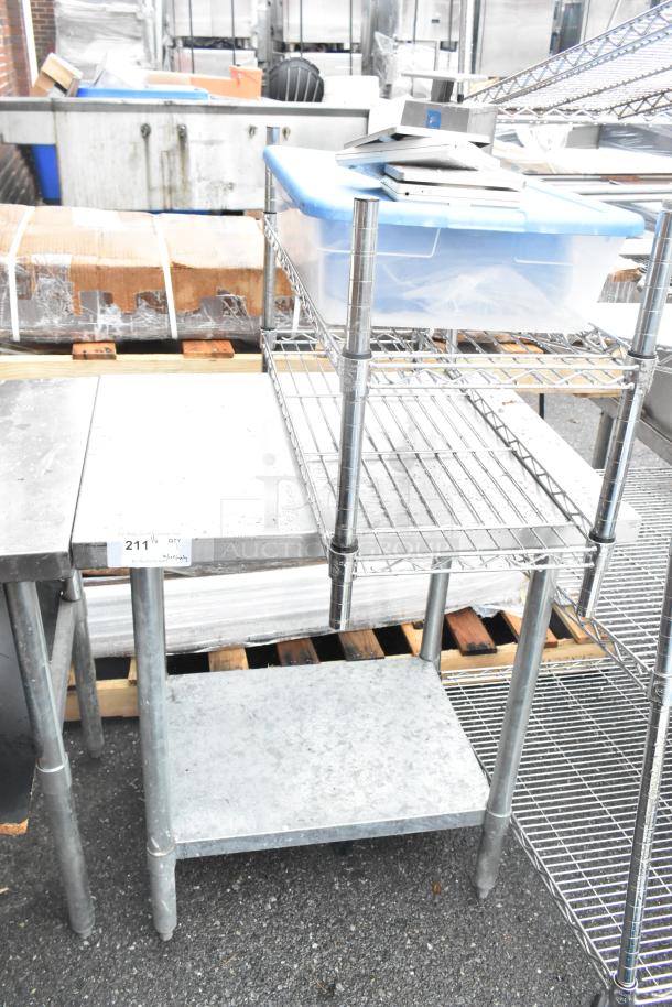 Stainless steel table with metal under shelf, includes wire shelving unit and plastic container; good condition.
