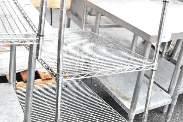 Chrome finish 4-tier wire shelving unit, sturdy construction, polished look, buyer must dismantle for shipping.