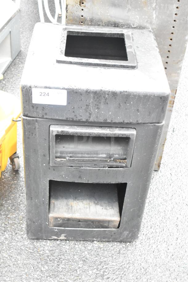 Black poly trash can, square opening, used condition, label reads "224".