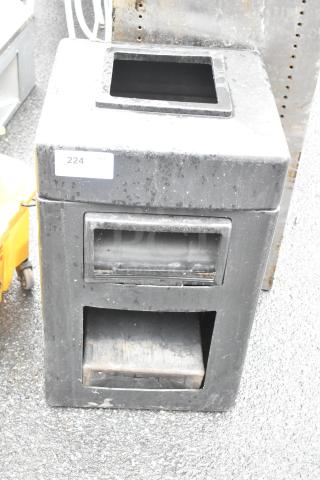 Black poly trash can, square opening, used condition, label reads "224".
