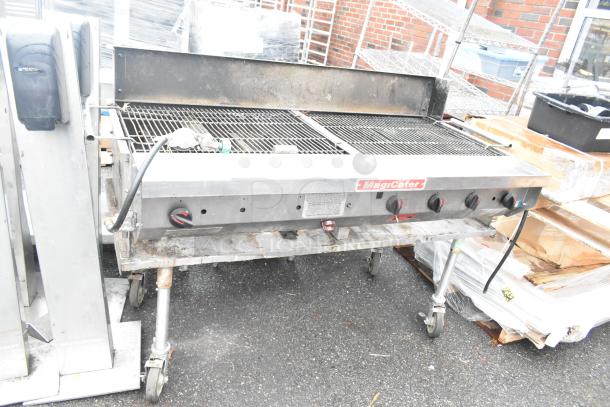 MagiCater stainless steel propane charbroiler grill, commercial casters, dual gas controls, moderate wear.