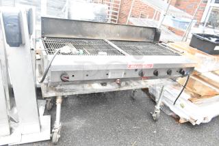 MagiCater stainless steel propane charbroiler grill, commercial casters, dual gas controls, moderate wear.