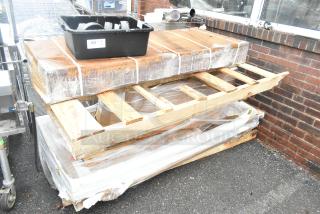 Unused pallet with various items including HLPLRW7230.LTM1 HON Mod 72"x30" Traditional Mahogany worksurfaces. Packaging visible.