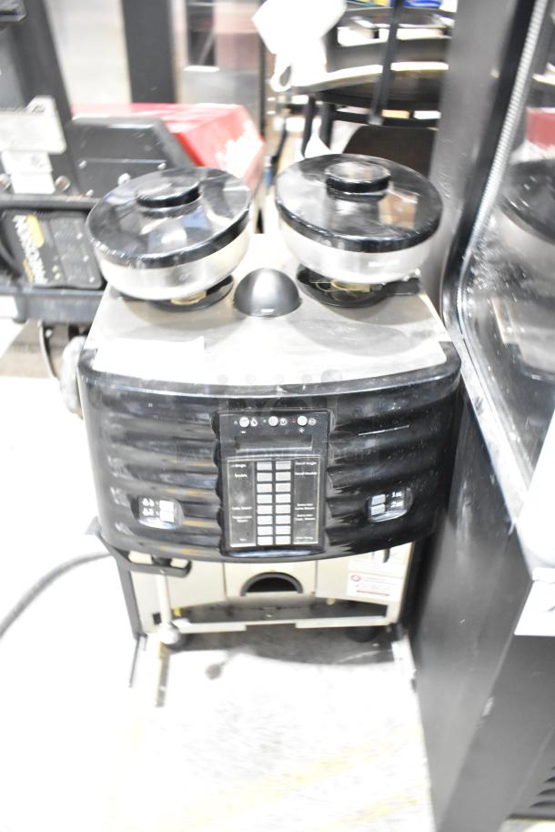 Schaerer SCA1 metal commercial espresso machine, dual hopper, button panel, 208-240V, used condition, 1 phase.