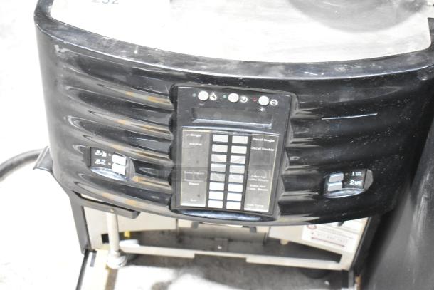 Schaerer SCA1 espresso machine, black metal, commercial countertop model. Control panel with buttons, 208-240V, 1 phase.