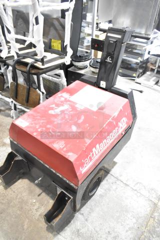 CartManager XD by Gatekeeper Systems, used cart retrieval machine, red surface with signs of wear, dual wheelbase.