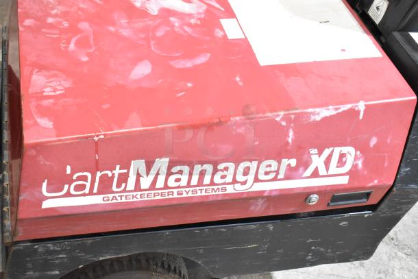 Red CartManager XD by Gatekeeper Systems, showing visible scratches and wear, with branding on the side.
