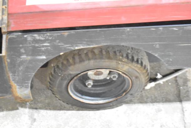 CartManager XD by Gatekeeper Systems, featuring a sturdy wheel and durable structure. Used condition with visible wear.