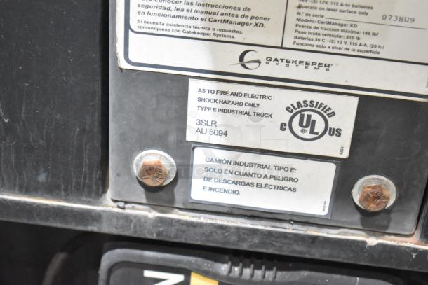 Gatekeeper Systems CartManager XD industrial truck label, model 073HU9; UL certified for fire and electric shock hazards.
