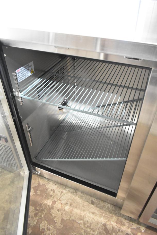 Avantco 178UBB4GHCS stainless steel back bar refrigerator, 90", glass door with LED lighting, visible broken glass pane.