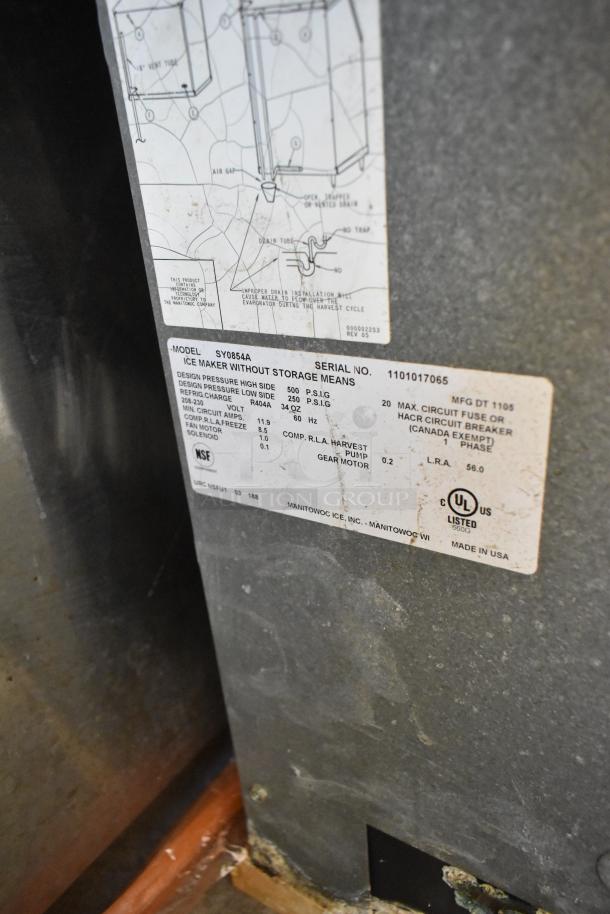 Manitowoc SY0854A stainless steel ice head, 208-230 volts, 1 phase. Model label visible, NSF and UL listed, made in USA.