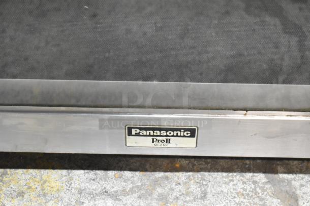 Panasonic NE-2180 stainless steel commercial microwave oven, 208 volts, 1 phase, model NE-2180, visible label.