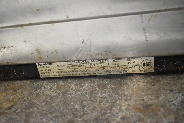 Panasonic NE-2180 microwave oven label showing model, 208V 1 phase, NSF certified, manufactured April 2016.