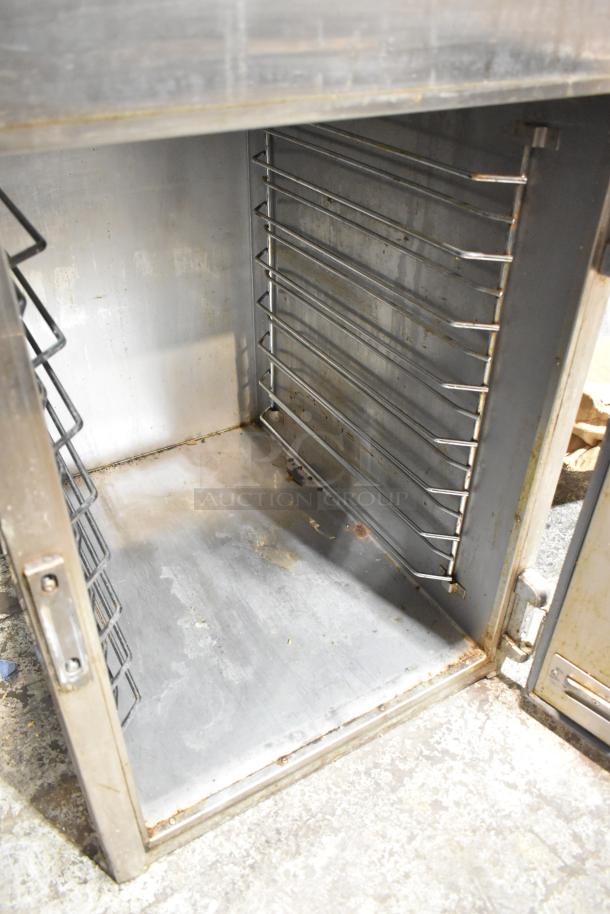 Alto Shaam 1000-UP/P Halo Heat cabinet, stainless steel, Dutch door, 8 pan capacity, visible wear inside.