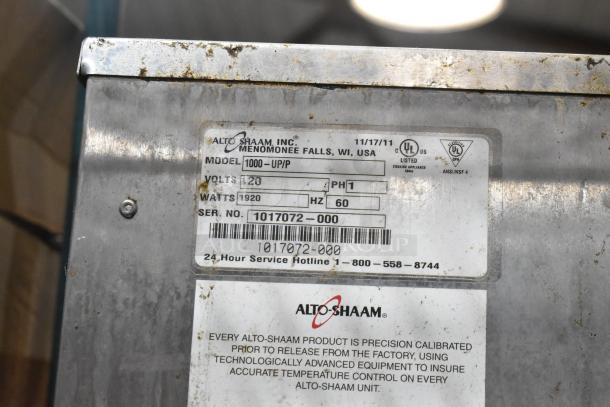 Alto Shaam 1000-UP/P stainless steel 8-pan holding cabinet label, showing model, voltage, and serial number details.