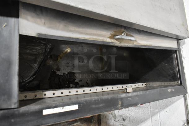 Perlick BC60 commercial back bar bottle cooler with 2 sliding lids, 115 volts, 1 phase. Metal construction, visible wear.