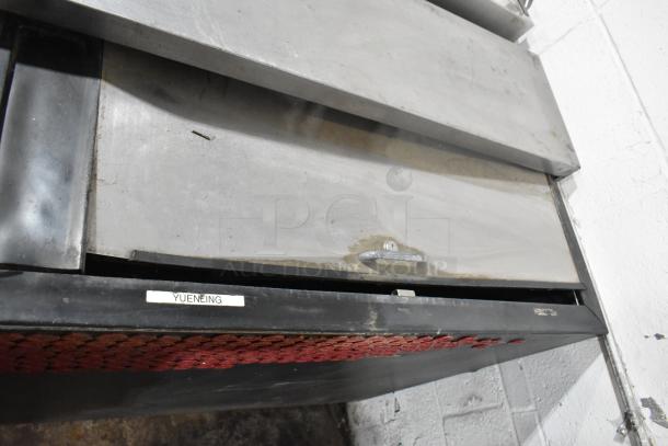 Perlick BC60 metal commercial bottle cooler with two sliding lids, 115V, 1 phase. Visible wear on metal; label reads "YUENGLING."