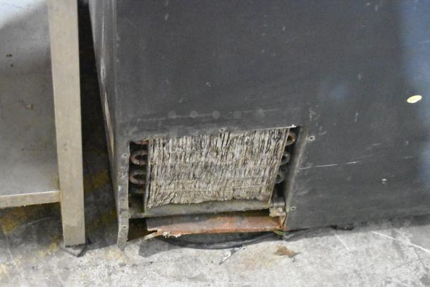 Perlick BC60 metal commercial back bar bottle cooler, visible wear, two sliding lids, 115 volts, 1 phase.