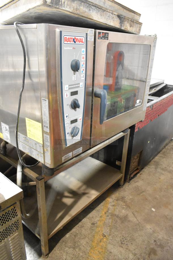 Rational CMP 62G Stainless Steel CombiMaster Plus natural gas combi convection oven on equipment stand, visible controls.