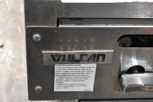 Vulcan Stainless Steel Commercial Countertop Charbroiler Grill, gas-powered, visible Vulcan logo, lighting instructions detailed.