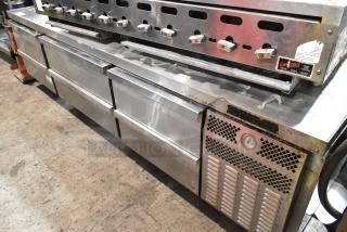 Continental stainless steel 6-drawer chef base on commercial casters, 115 volts, used condition. Features control knobs and vented panel.