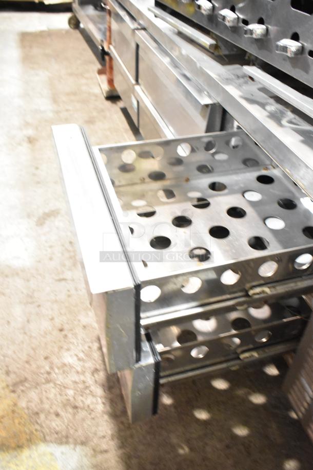 Continental stainless steel chef base with six drawers, on commercial casters. Features a perforated design. 115V, 1 phase.