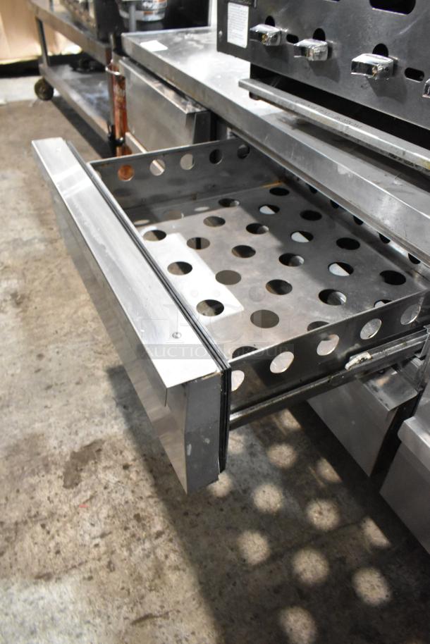 Continental stainless steel 6-drawer chef base, on commercial casters, perforated drawers, 115 volts, 1 phase.