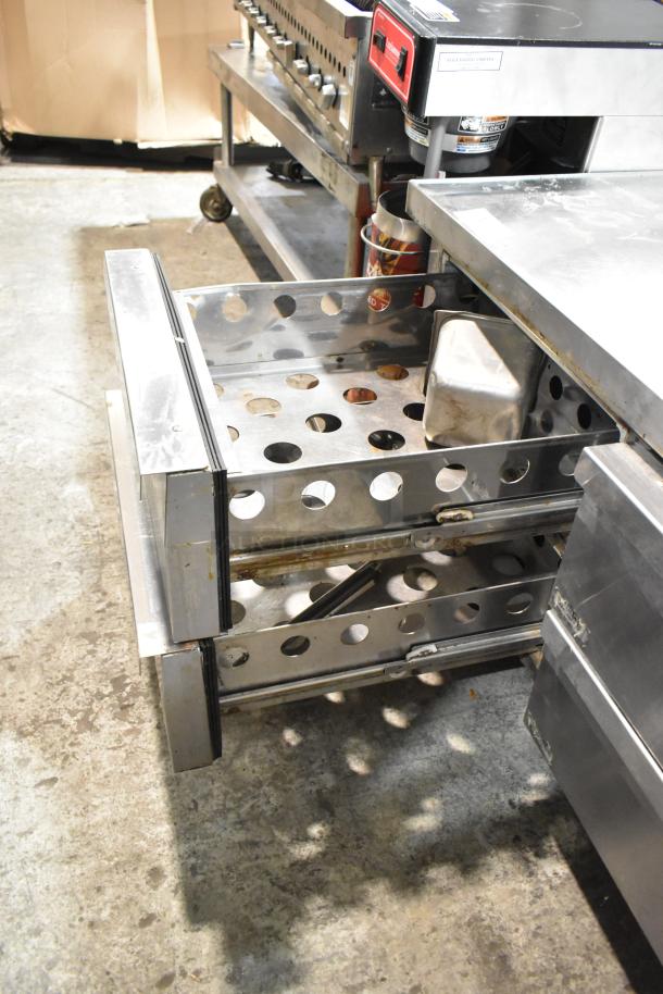 Continental stainless steel commercial 6-drawer chef base on casters, 115V, 1 phase, durable construction, good condition.