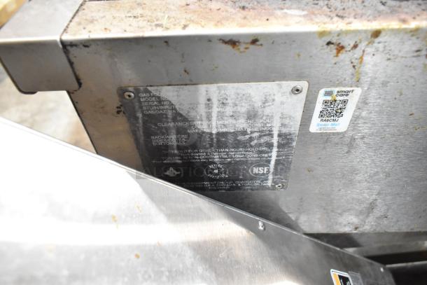 Vulcan stainless steel commercial charbroiler grill, natural gas, on equipment stand with commercial casters. Plate shows model and NSF label.