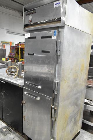 Continental 1R-HD stainless steel commercial reach-in cooler with two half doors on casters, 115V, 1 phase. Signs of wear.