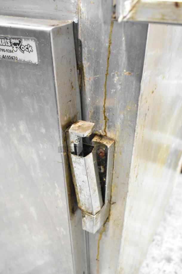 Continental 1R-HD stainless steel cooler, 2 half-size doors, commercial casters, visible wear, 115V, 1 phase.