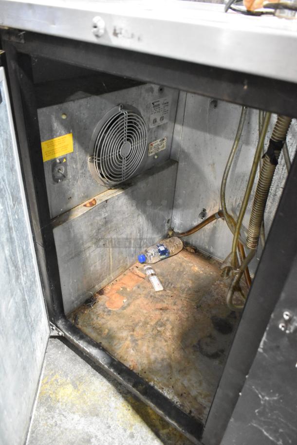 Micro Matic MDD-58 kegerator interior showing fan, wiring, and some rust. Visible labels indicate power specs: 115 Volts, 1 Phase.