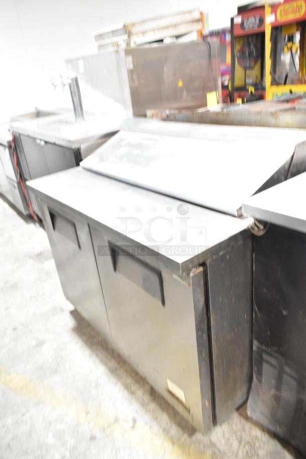 True TSSU-48-12 stainless steel sandwich salad prep table, commercial casters, model TSSU-48-12, 115V, 1 phase.