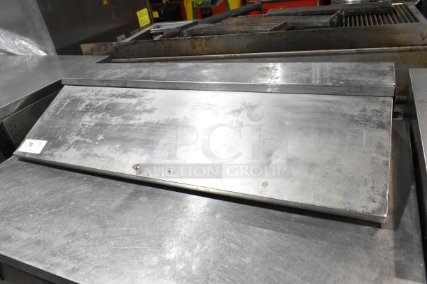 True TSSU-48-12 stainless steel prep table, bain marie top. Used condition, visible wear. Includes commercial casters.